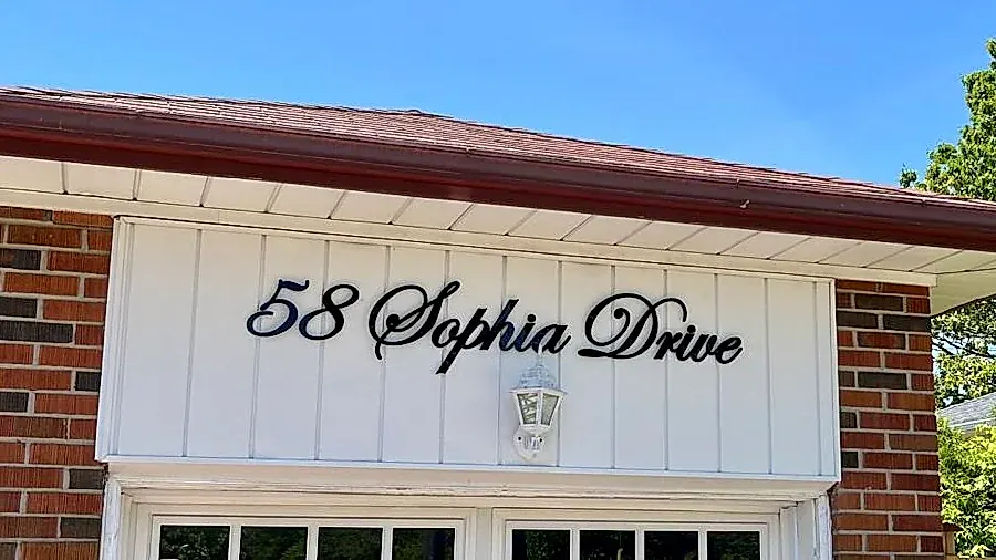 58 Sophia Drive in matte black on a white board-and-batten gable
