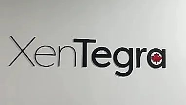 XenTegra lettering in black Alupanel on a white interior wall